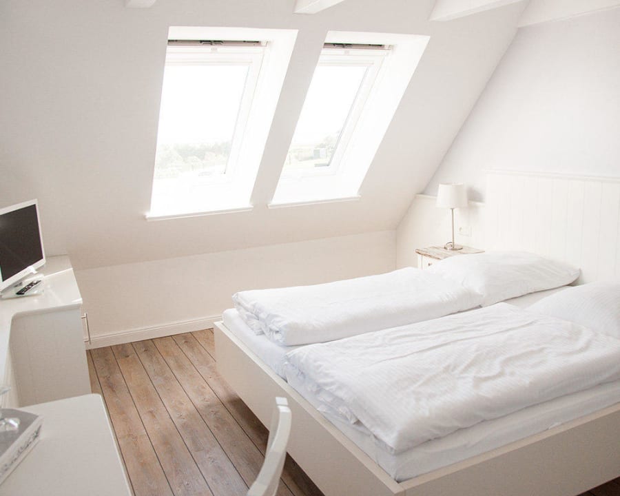 Schlafzimmer im Suitenhaus Hotel Ual Öömrang Wiartshüs