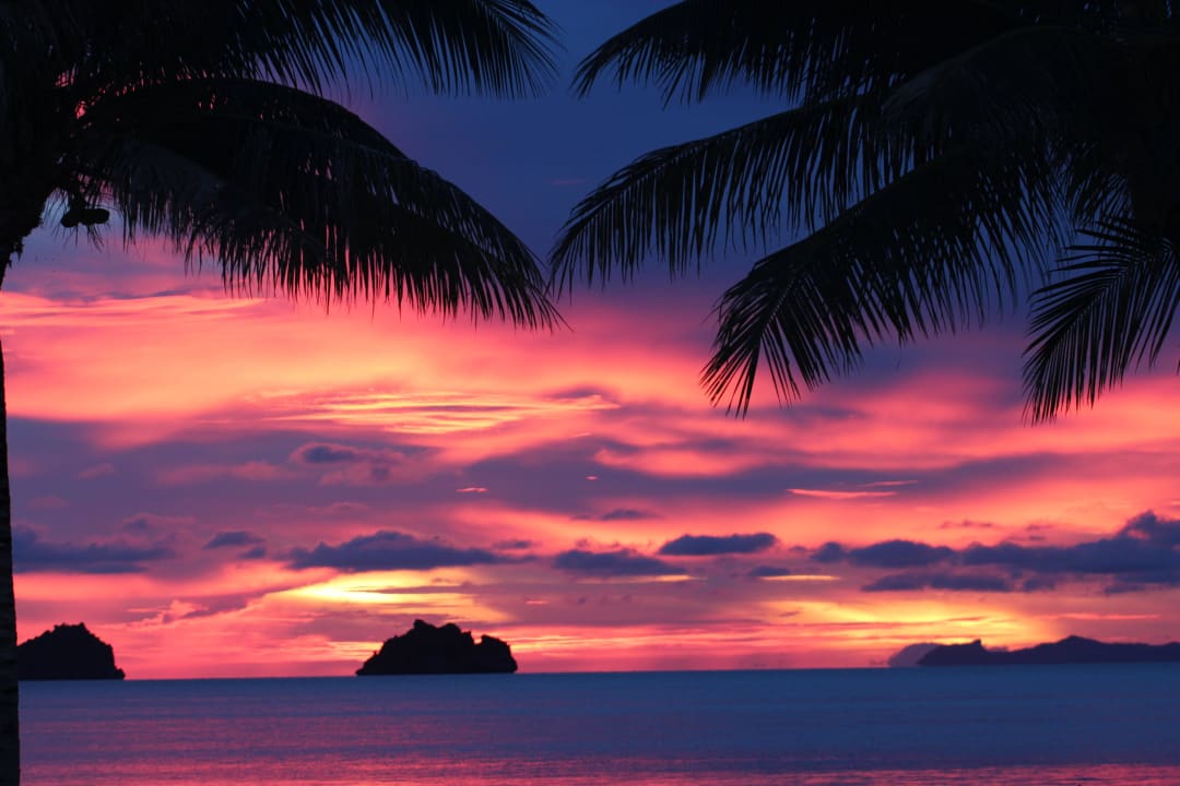 Sunset view over the famous 5 islands Sibaja Palms Sunset Beach Luxury Villas