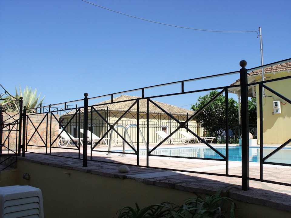 Black golden fences around the swimming pool Avra Paradise