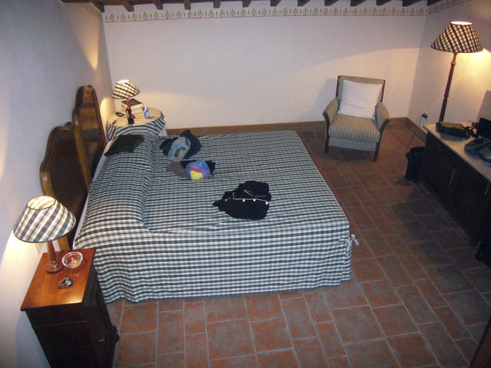 Schlafzimmer im Lupo Apartments Borgo Corsignano