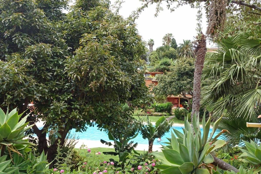 Blick auf den Pool vom Garten aus Hotel Quinta Splendida Wellness & Botanical Garden