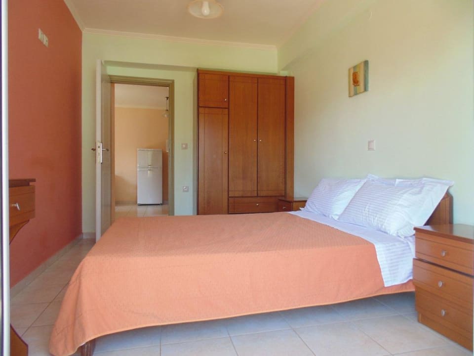 Bedroom in 2bedroom apartment and kitchen  Bayside Apartments