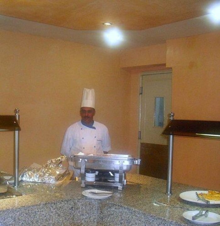 Koch bei der Arbeit Hotel Paradis Palace