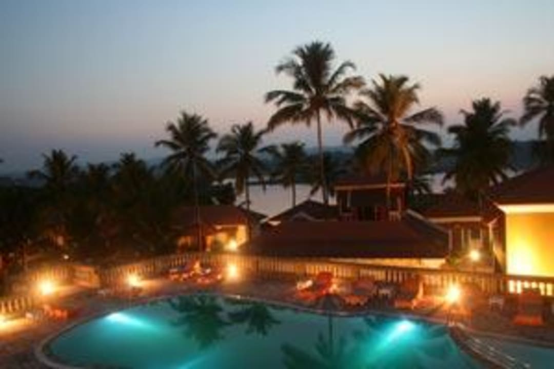 Pool by night Mercure Goa Devaaya Retreat