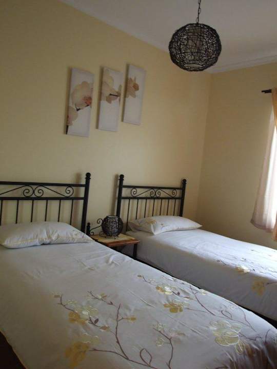 O twin room Villas Paraiso das Flores