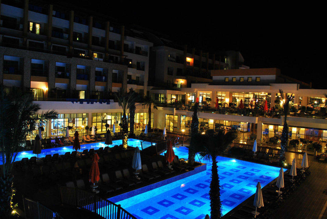 Swimming pool at night Port Nature Luxury Resort & Spa