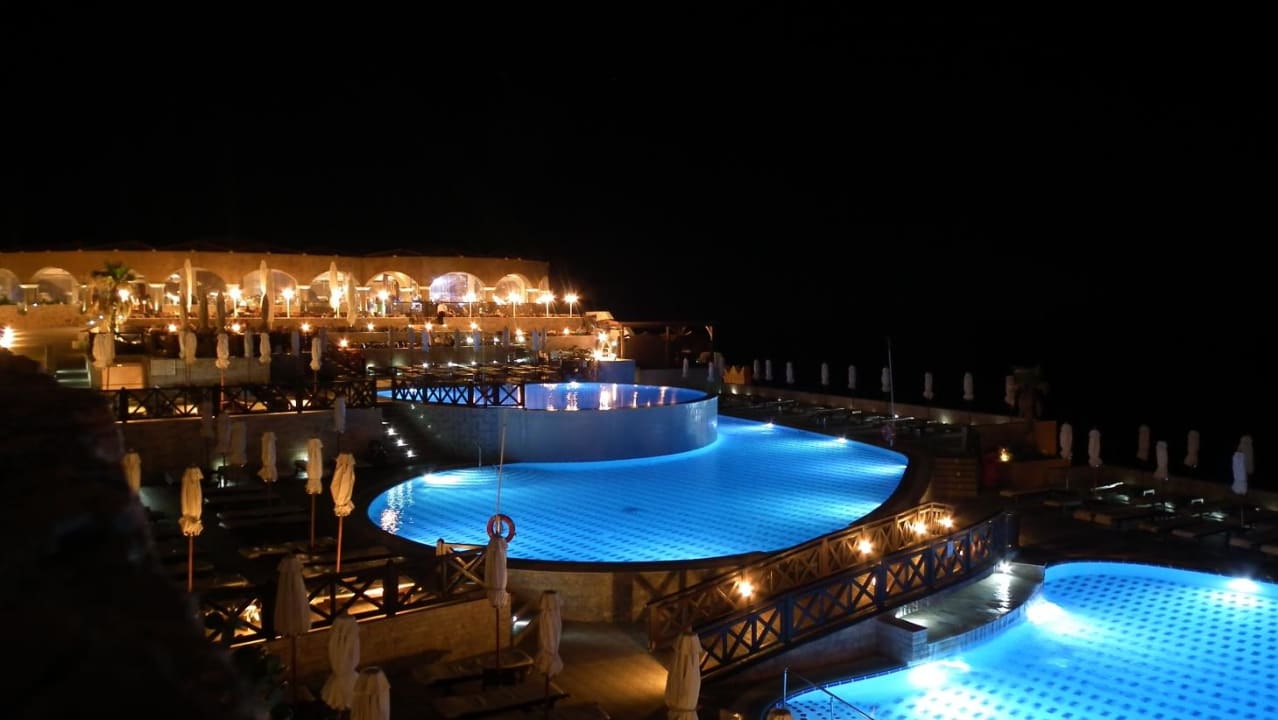 Pool am Abend Hotel Kalithea Horizon Royal