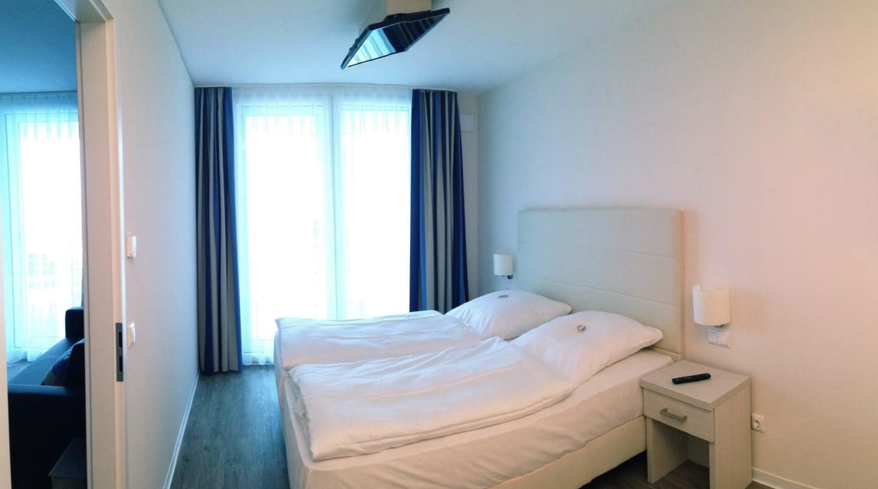 Das erste Schlafzimmer Apartmenthaus Hafenspitze - Apartment 33