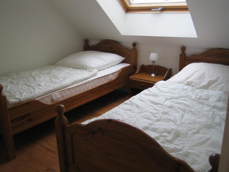 Schlafzimmer mit 2 Einzelbetten Ferienwohnungen 10-6 Papillon