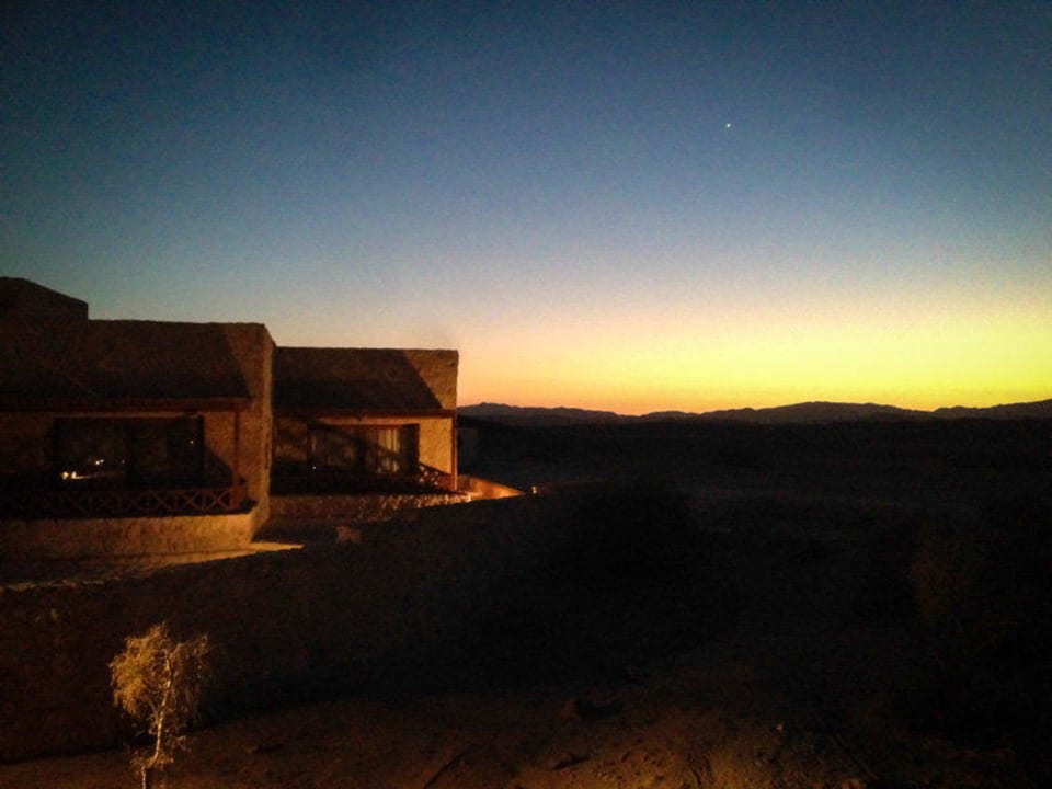 Chalets im Sonnenuntergang The Oasis Dive Resort