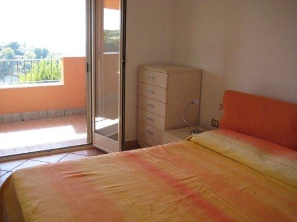Schlafzimmer mit Balkon Residenza La Contura
