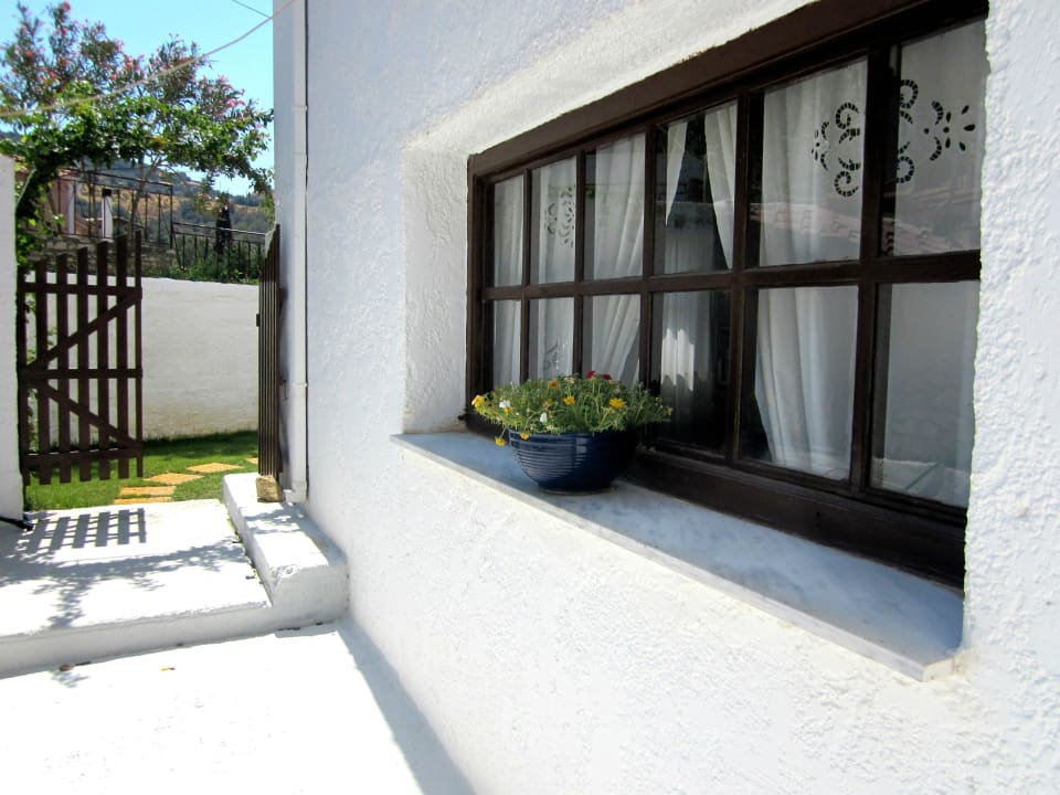 Traditional white walls and local stone floors Scorpios Hotel & Suites