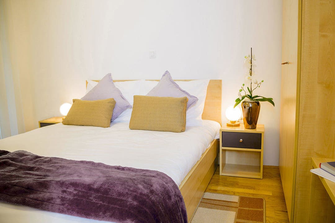 King-size bed in superior rooms and apartments Postojna cave Rooms & Apartments Proteus