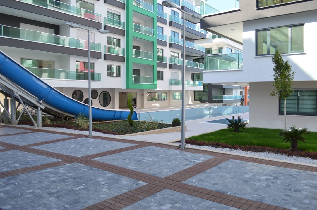 Outdoor pool slides Direct Beach Apartments