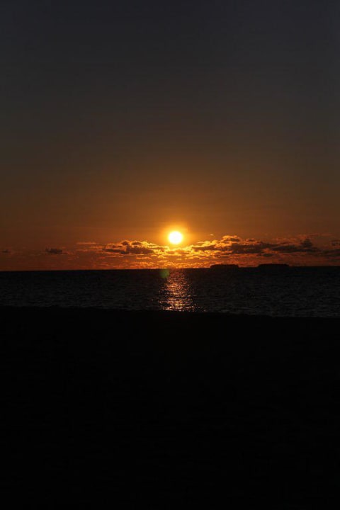 Sonnenuntergang Thulhagiri Island Resort
