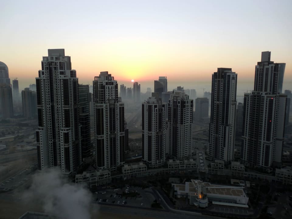 Sonnenaufgang im Morgennebel Apartments Hotel City Premiere