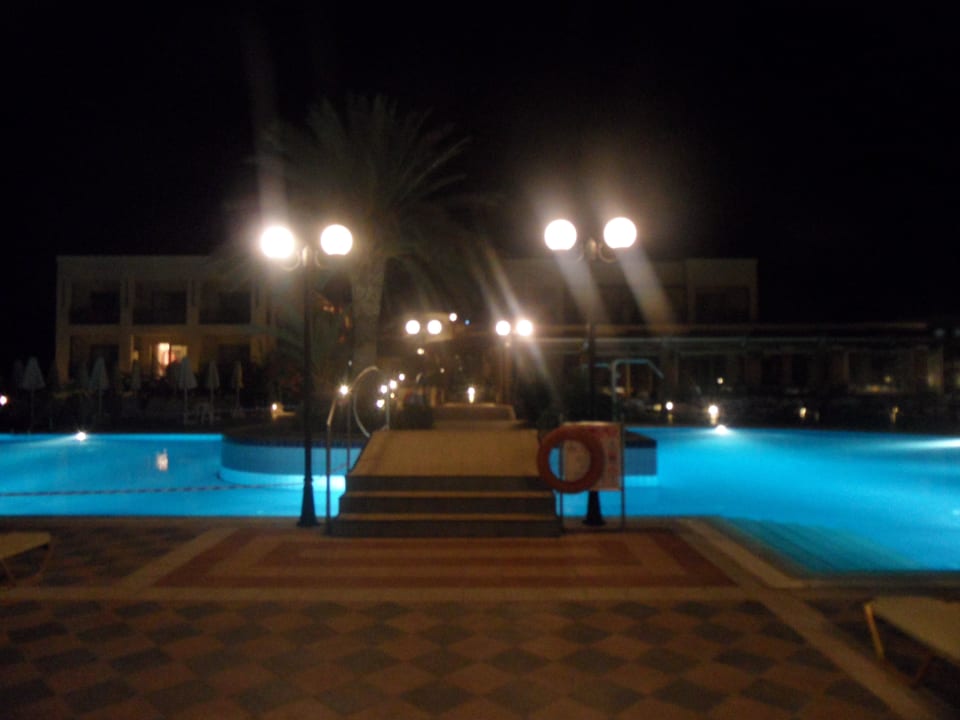 Pool by night Hydramis Palace Beach Resort