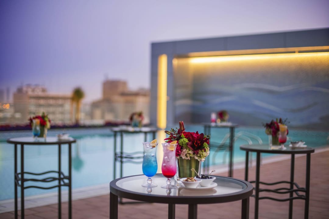  Evening Coctails Next to the Swimming Pool Downtown Rotana