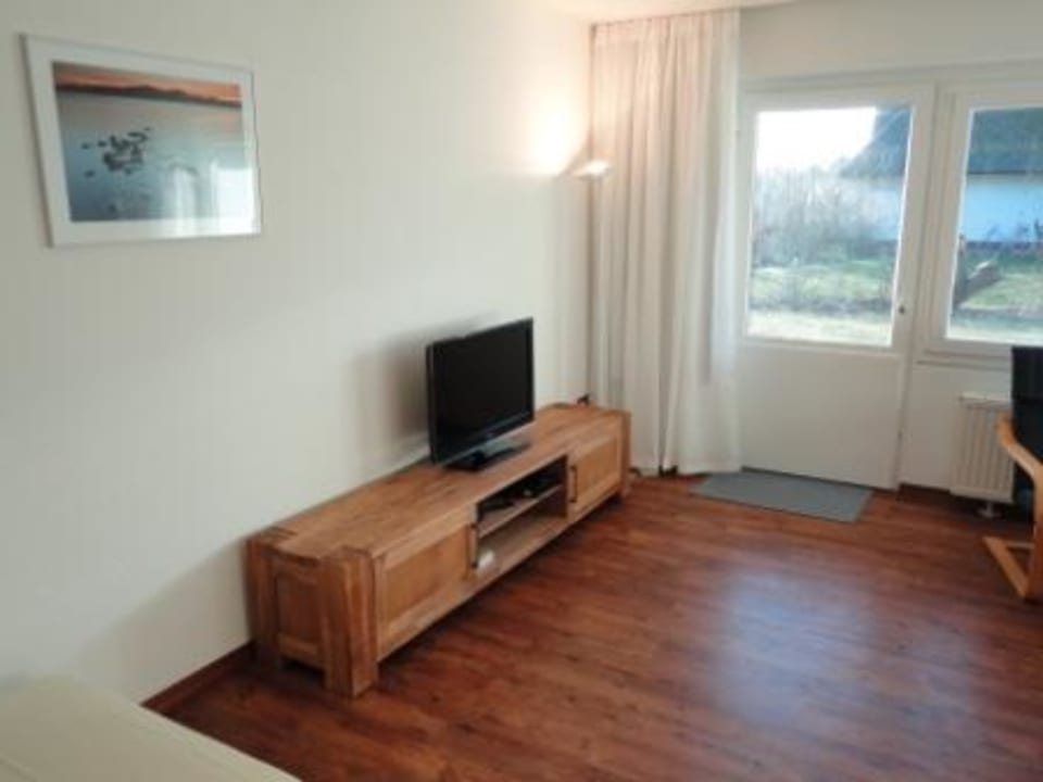 Blick vom Wohn-Essbereich zur Terrasse Hotel Reetdachhaus Gräftendiek Drei