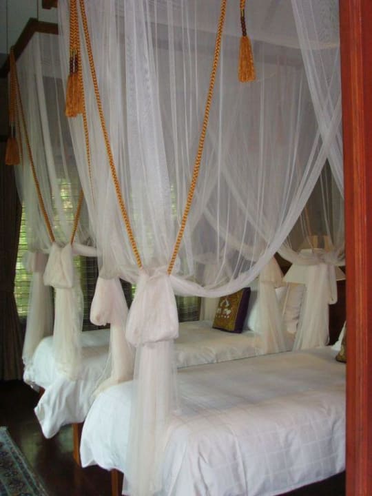 Himmelbett im Traumhotel The Dhara Dhevi Chiang Mai