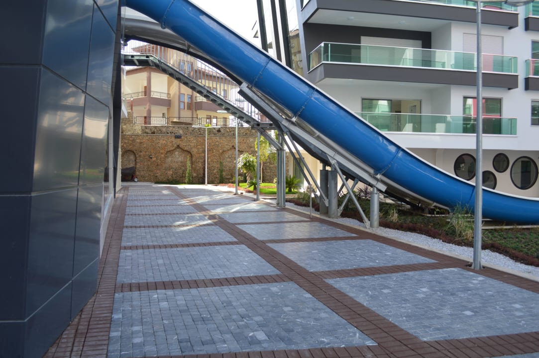 Outdoor pool slides Direct Beach Apartments