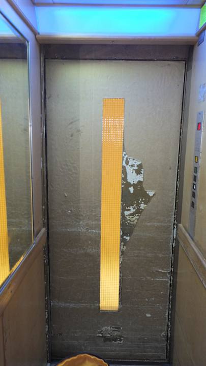 Narrow run down elevator Astral Palma Hotel