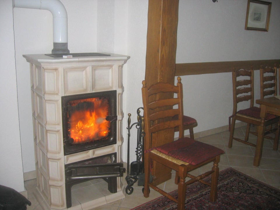 Fireplace in living room Gästehaus  und Ferienhaus Erich Bremm