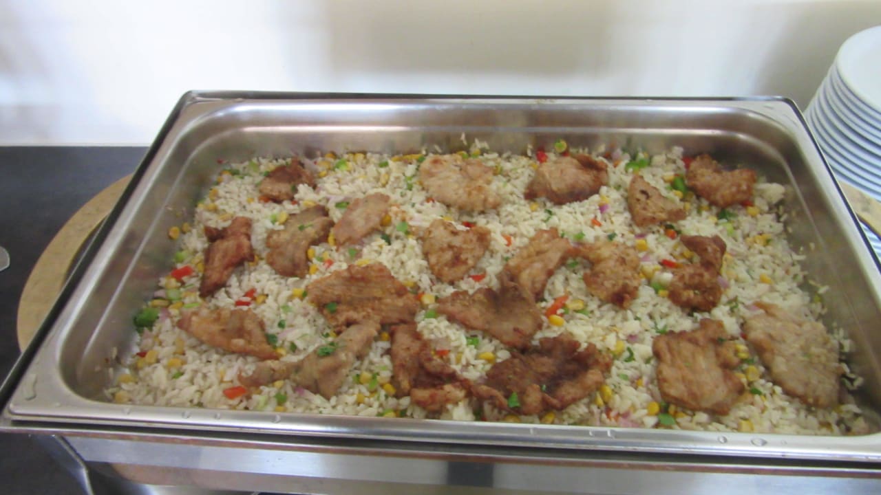 Schweinebraten mit Reis Hotel Aris