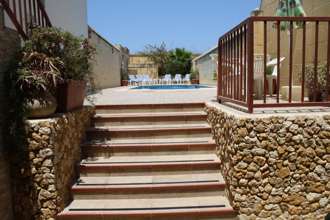 Outdoor terrace leading to pool area Ta' Leli Farmhouse