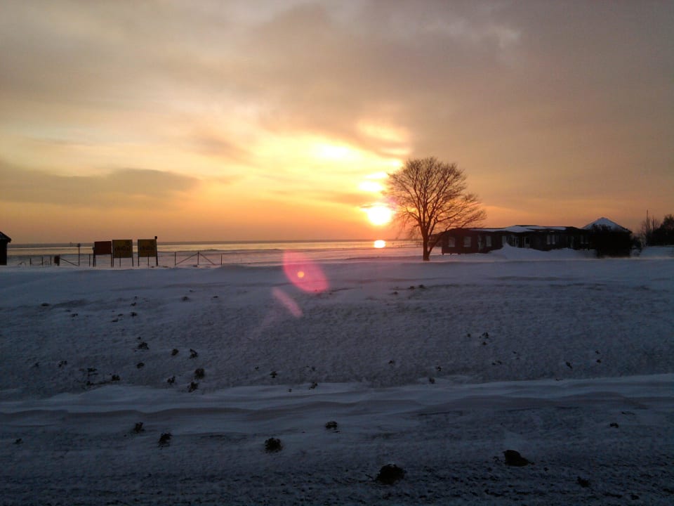 Sonnaufgang im Winter Upstalsboom Hotel am Strand