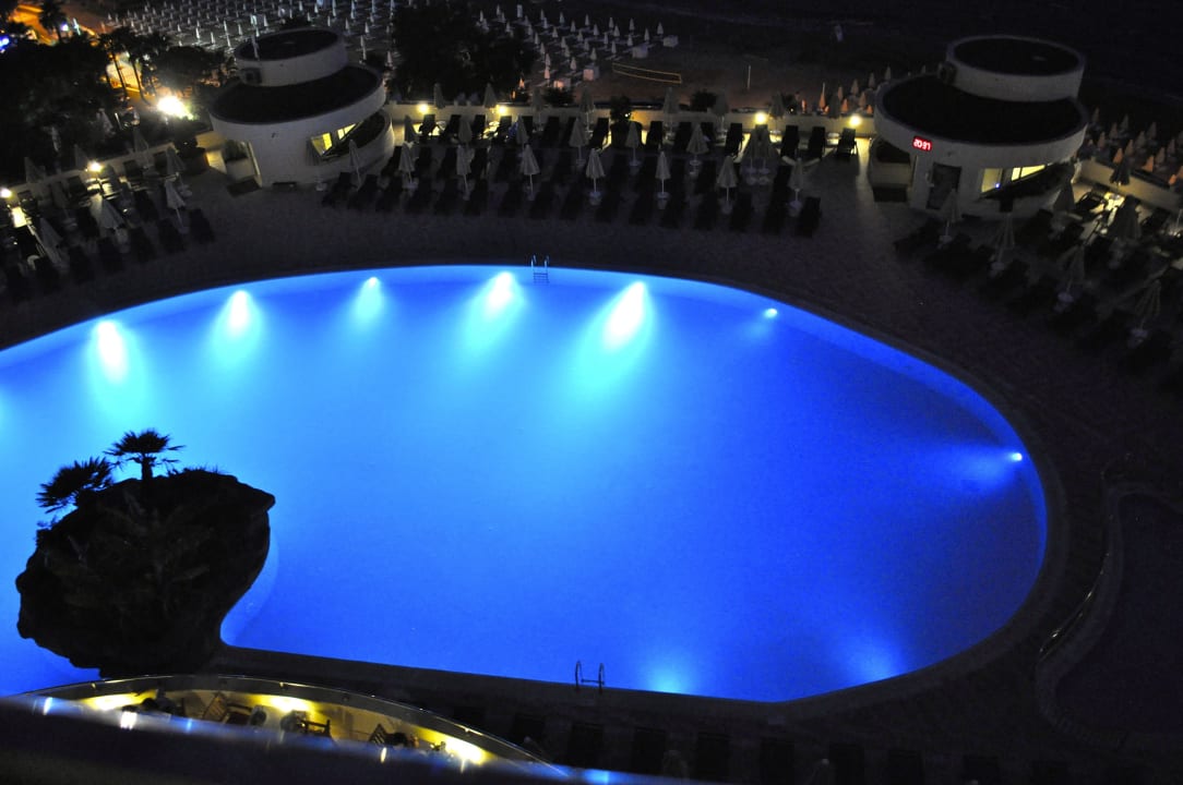 Pool by night Melas Resort Hotel