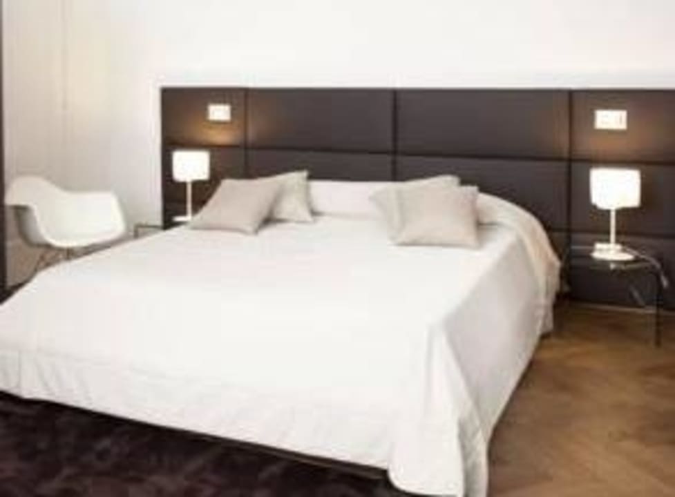 Кровать в номере  Hotel Corte DiGabriela