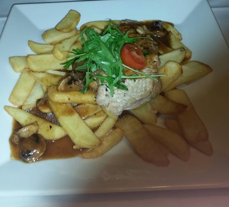 Schweinesteak mit Champions, Pommes Vienna House Easy Pilsen
