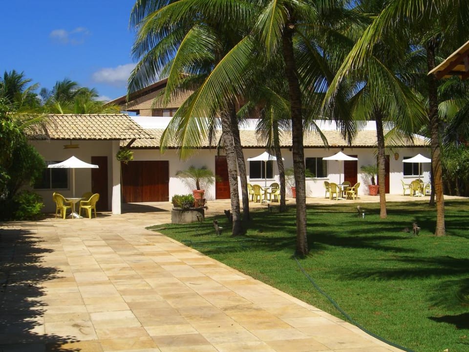 Entrance through coconut grove Vila Coqueiros