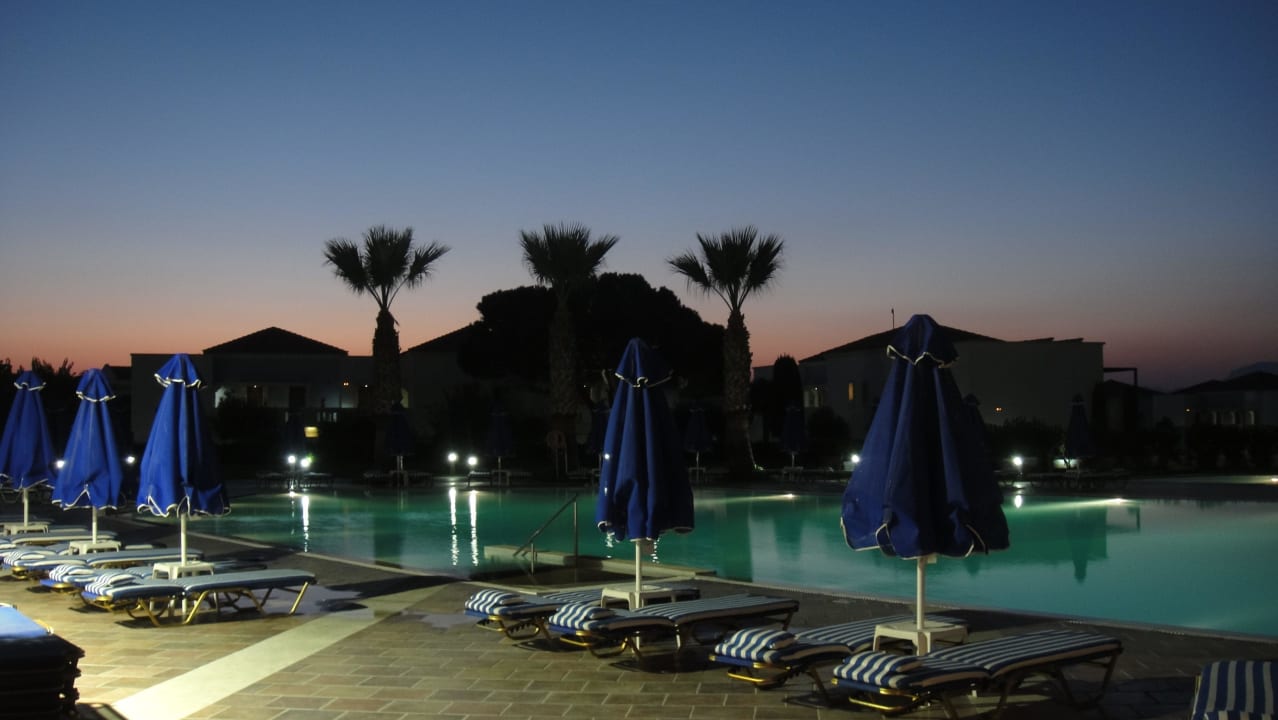 Pool by night Neptune Luxury Resort