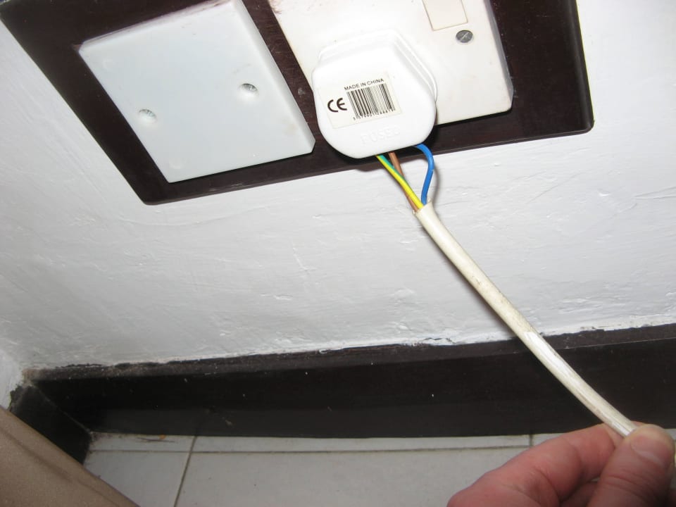 Stecker zum Kühlschrank PrideInn Flamingo Beach Resort & Spa