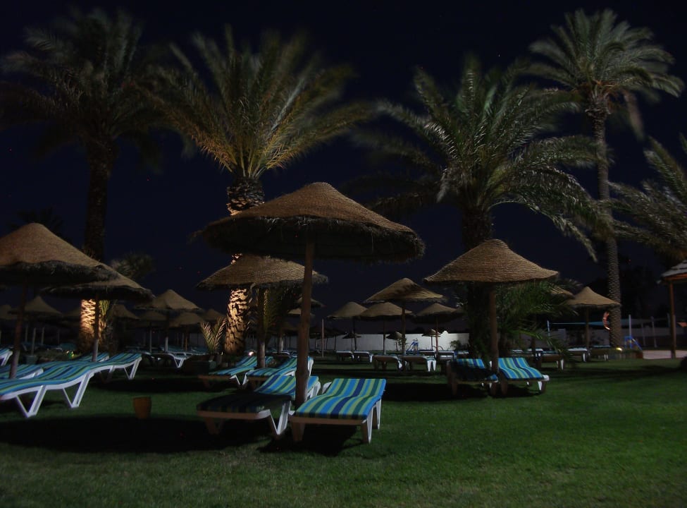 Surroundings of the pool by night Monarque Club Rivage