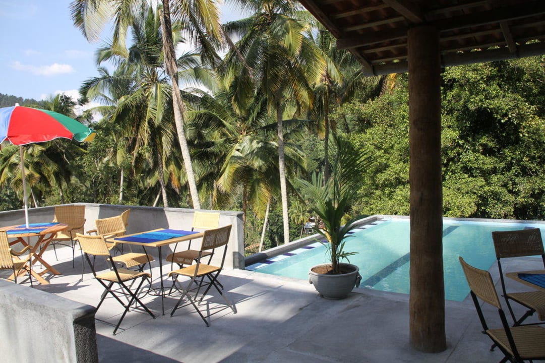 Swimming pool with terrace on top of the rock Country Garden Resort
