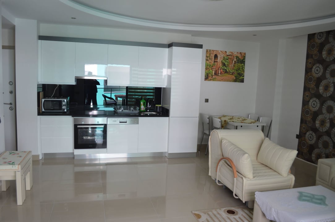 Living room with kitchen Direct Beach Apartments