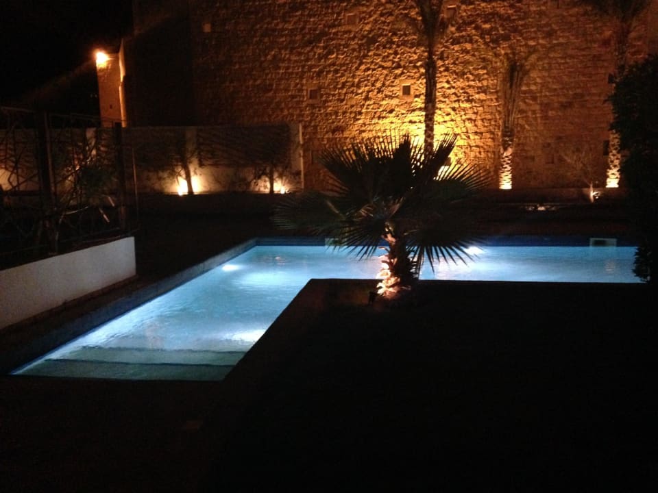 Villa pool in the evening Fort Arabesque Resort, Spa & Villas