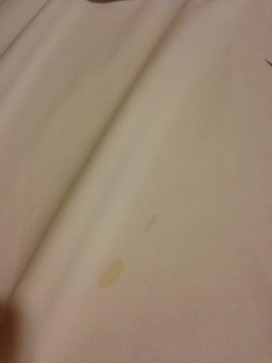 Stained top sheet (which is used as cover sheet The House of Tulpan