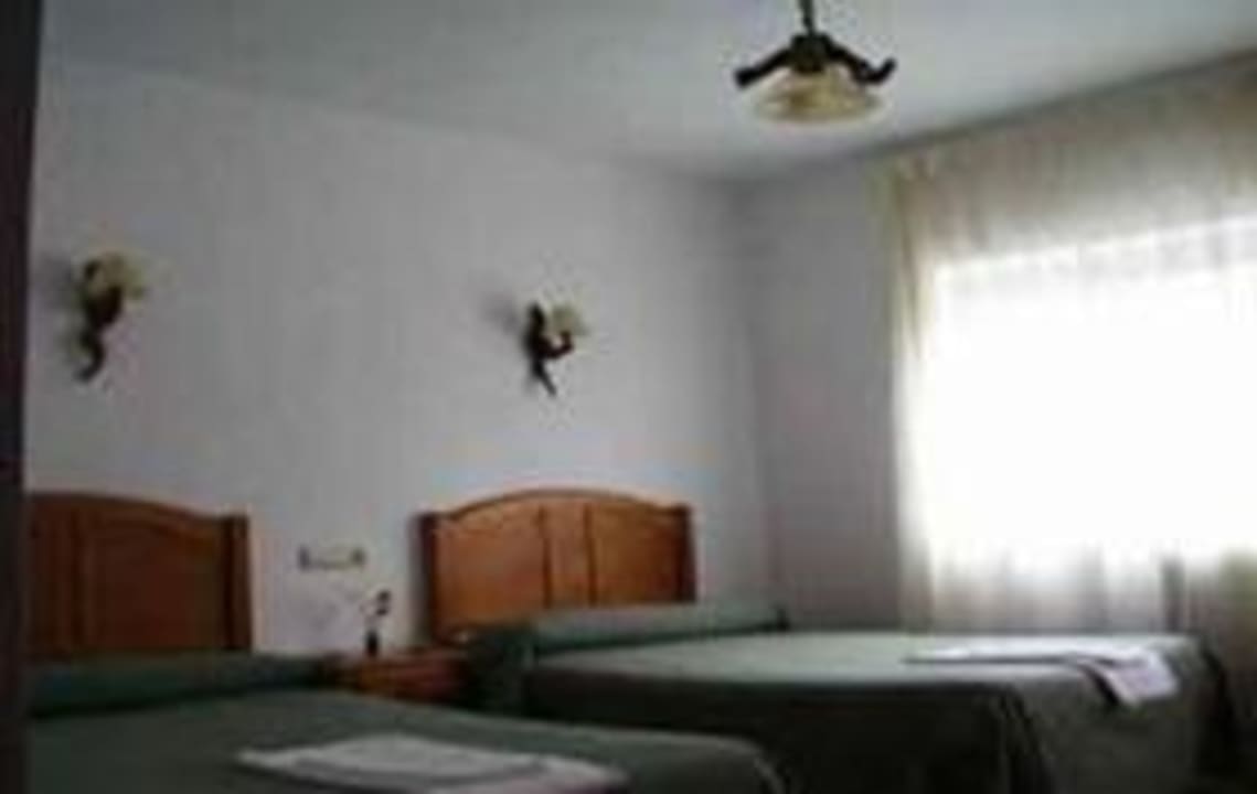 Dormitorio dos camas Hostal Río Mundo