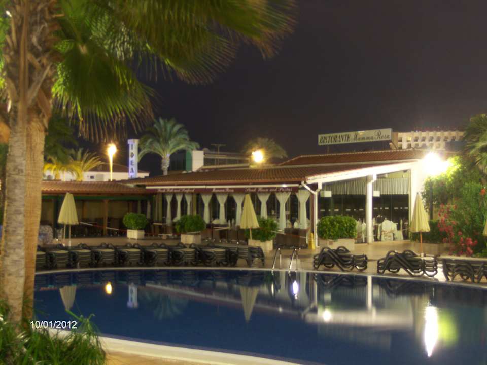 Pool at night. Mama Rosa`s in the background. Apartments Colon II