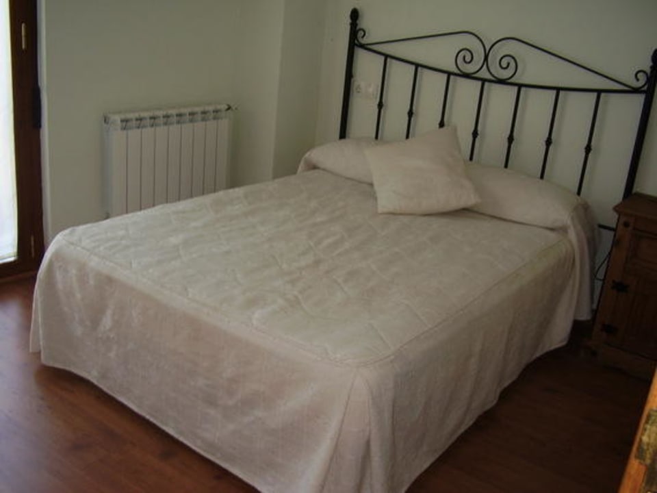 Habitación con una cama Hostal El Horno