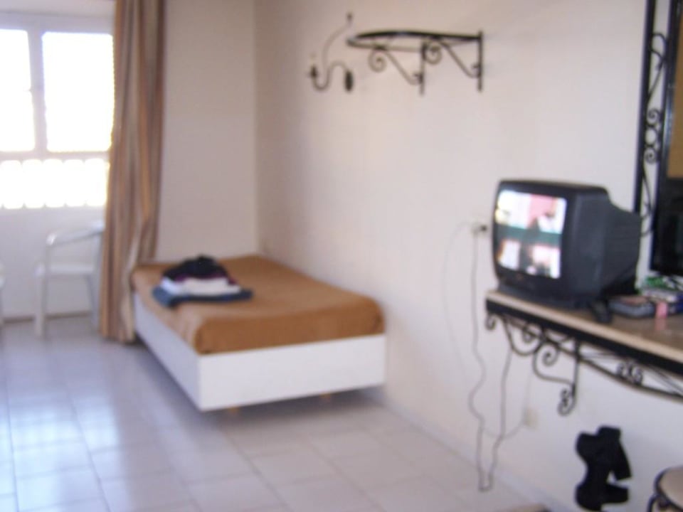 Eines der vier Betten  in 124 Houda Golf & Beach Club