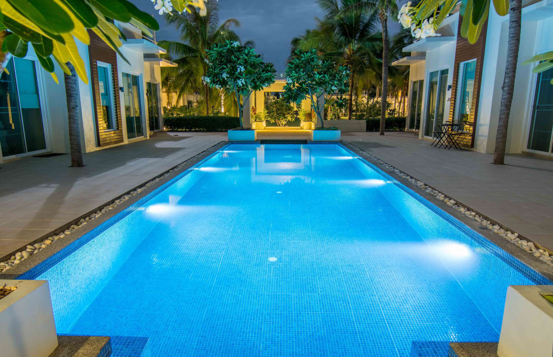 Pool at night The Beach Village Resort