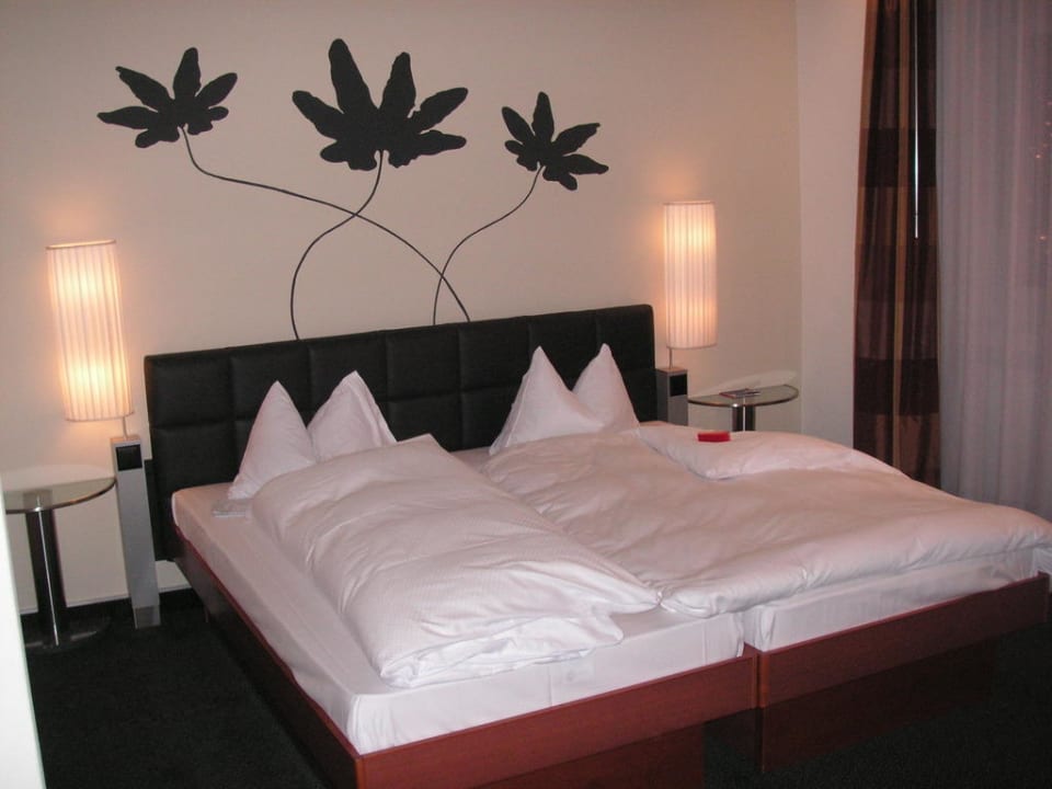 Das Zimmer mit Bett Hotel Basel - Da wohnen, wo Basel lebt!