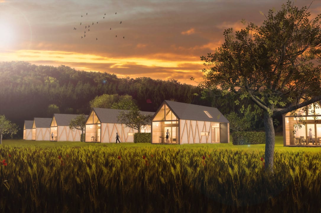 Sechs Premiumchalets in der Abendstimmung Hainichhöfe Premiumchalets
