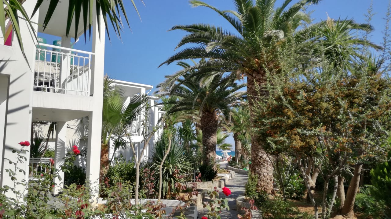 Gartenanlage HARPIN Happy Days Beach Hotel