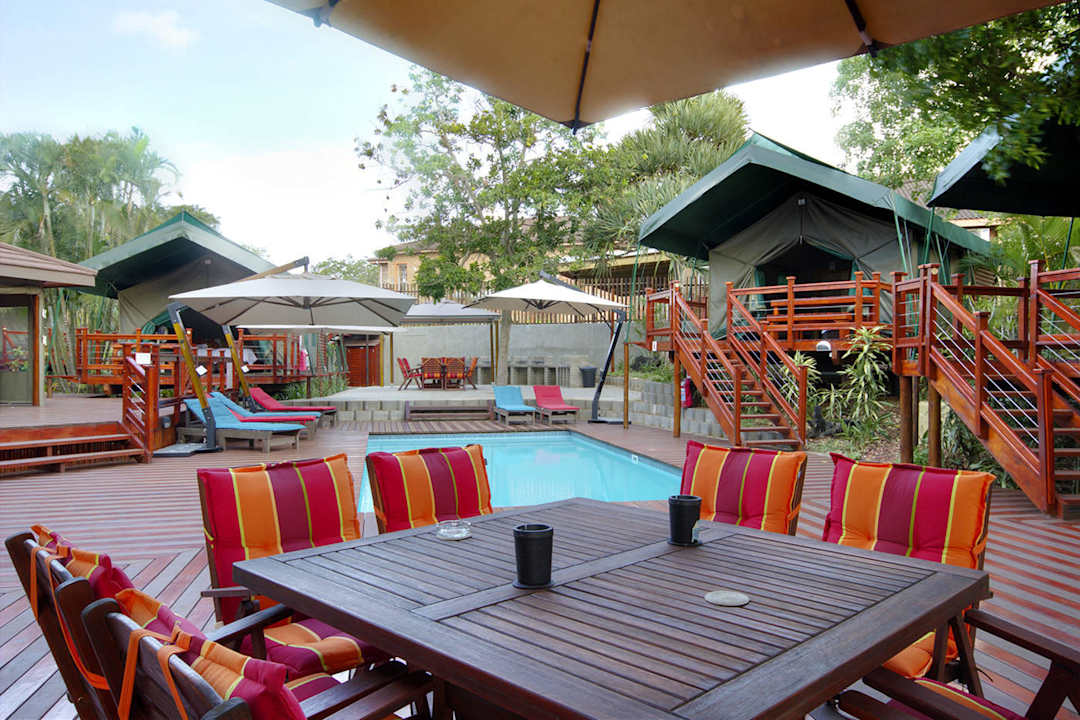 Sundeck and pool Monzi Safaris Tented Lodge